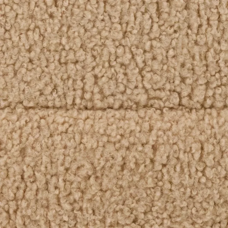 Arthur-Itis Cover in Rice Pudding: close-up of the curly oatmeal teddy fleece, with a seam across it.