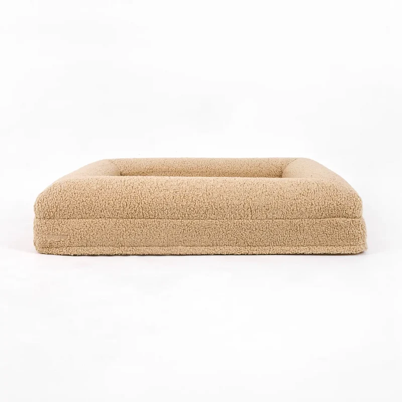 Teddy Cover in Rice Pudding on a Barney Bed, from the front: beige teddy fleece on the base and bolster.