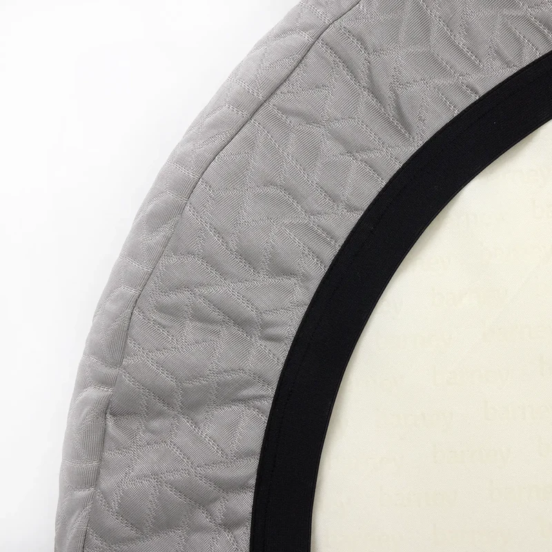 Grey cooling dog bed with a quilted design and black trim