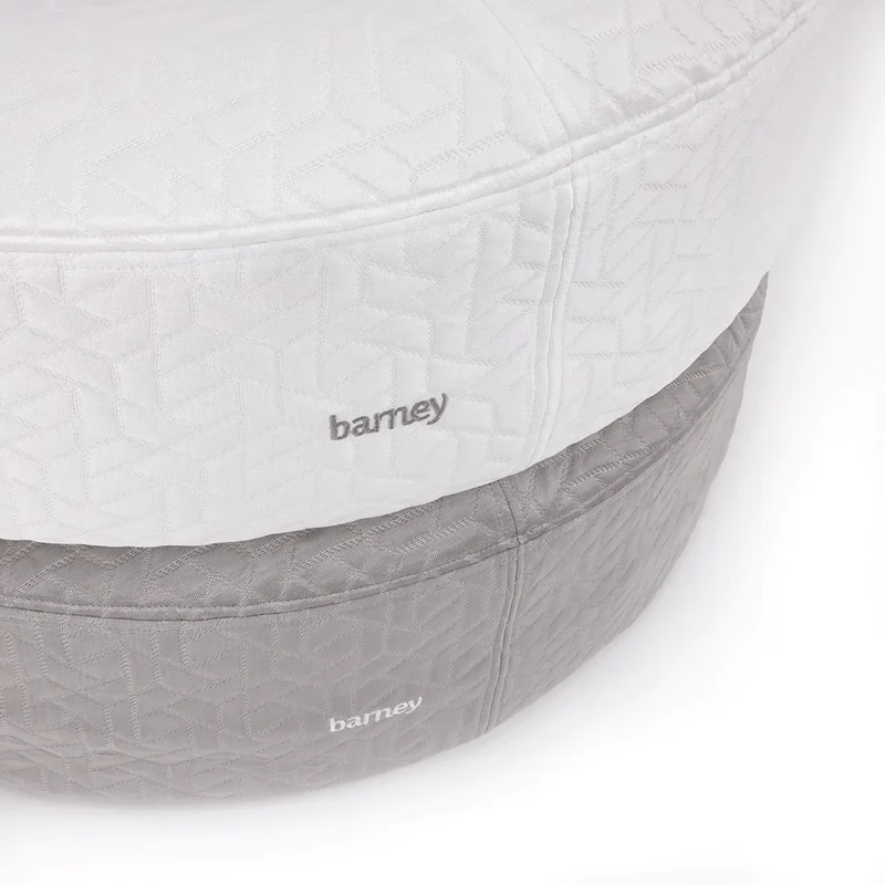 Iceberg and grey cooling dog beds stacked together