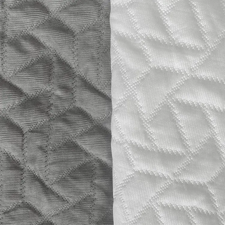 Cooling Cover fabrics side by side: grey Silver on the left, Iceberg White on the right, both quilted in a geometric pattern.