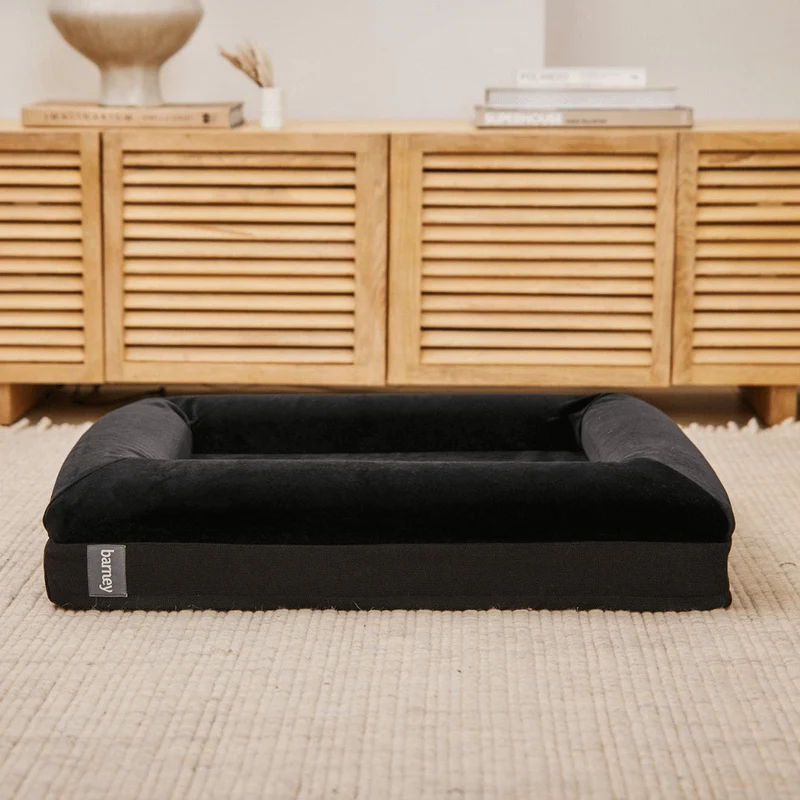 Original Cover in Jet Black: the bed on its own, black velvet bolsters over a black woven base with a grey "barney" tab.