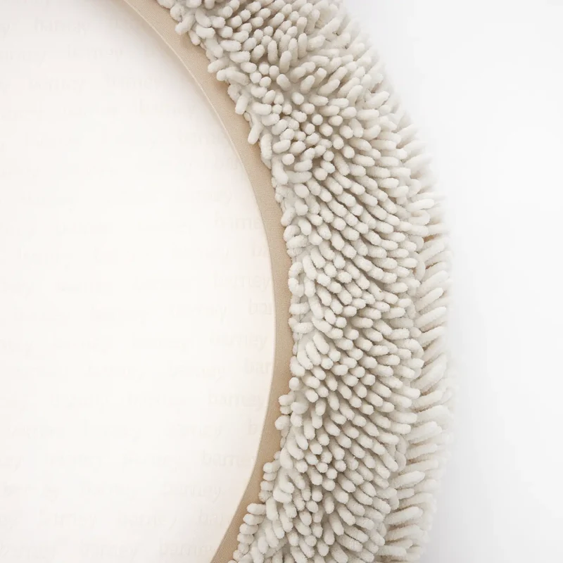 Barneycles Cover Curl in Sugarloaf: the underside, cream chenille loops around a pale base printed with "barney".