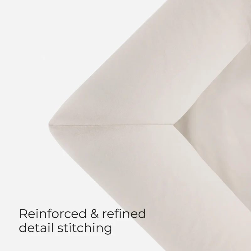 Stitched corner of a Barney Bed in Bone, with the words Reinforced & refined detail stitching