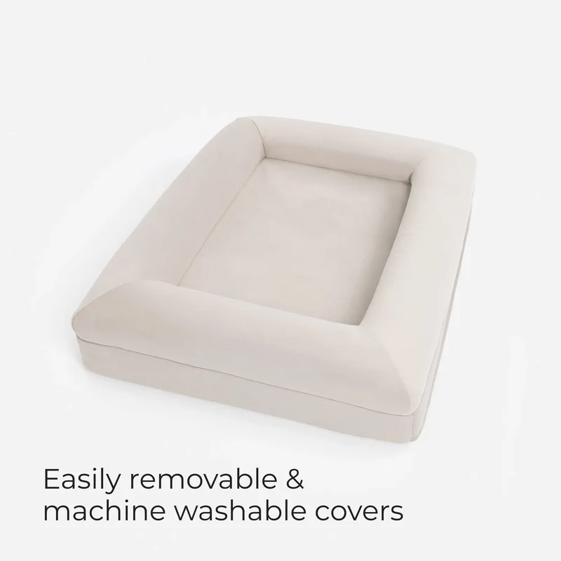 Barney Bed in Bone seen from above, with the words Easily removable & machine washable covers
