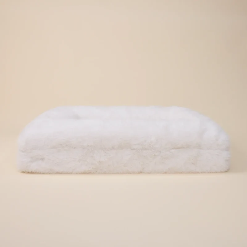 Fur Cover in Chibby on a Barney Bed: the bed on its own from the front, covered in fluffy white faux fur.