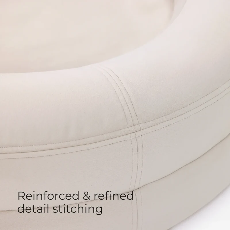 Stitched seams on a BarneyCurl Bed in Bone, with the words Reinforced & refined detail stitching