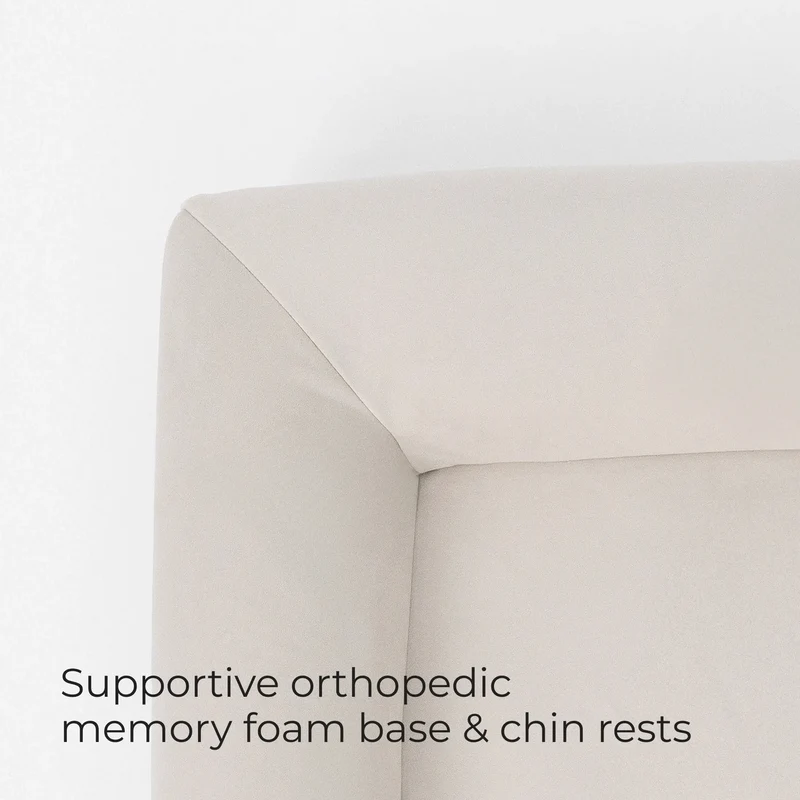 Bolster corner of a Barney Bed in Bone, captioned supportive memory foam base and chin rests