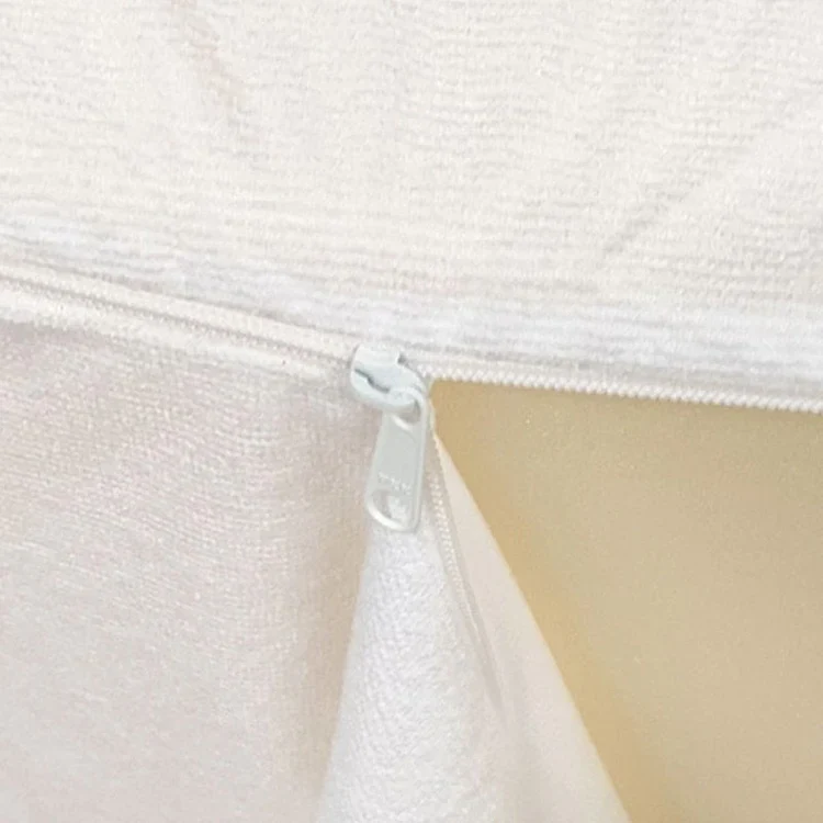 Waterproof Lining Kit: close-up of the white zip partly open on the terry lining, with the yellow foam showing through.