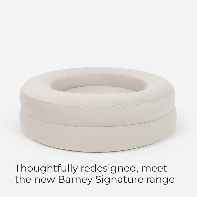 BarneyCurl Bed in Bone with the words Thoughtfully redesigned, meet the new Barney Signature range