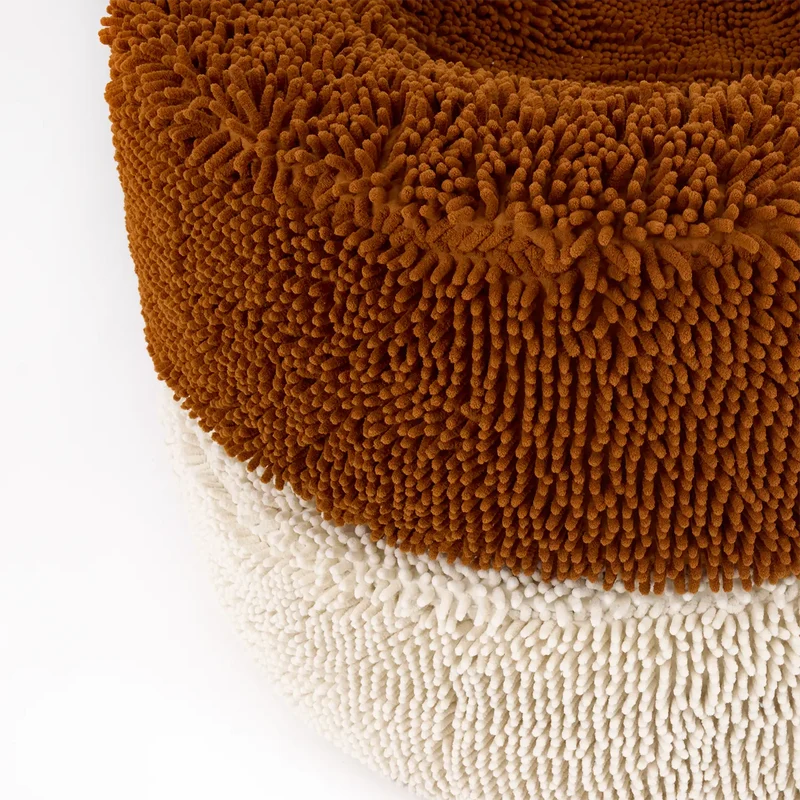 Barneycles Cover Curl in Fur Seal and Sugarloaf: close-up of a rust brown chenille bed stacked on a cream one.
