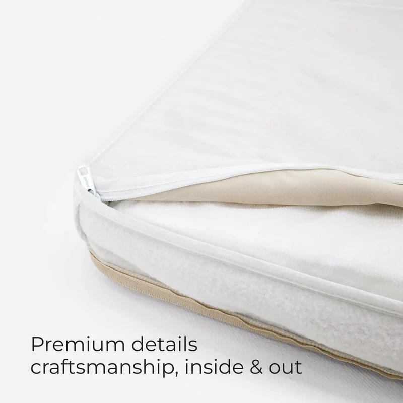Barney Bed cover unzipped to show the white inner liner, with the words Premium details craftsmanship, inside & out