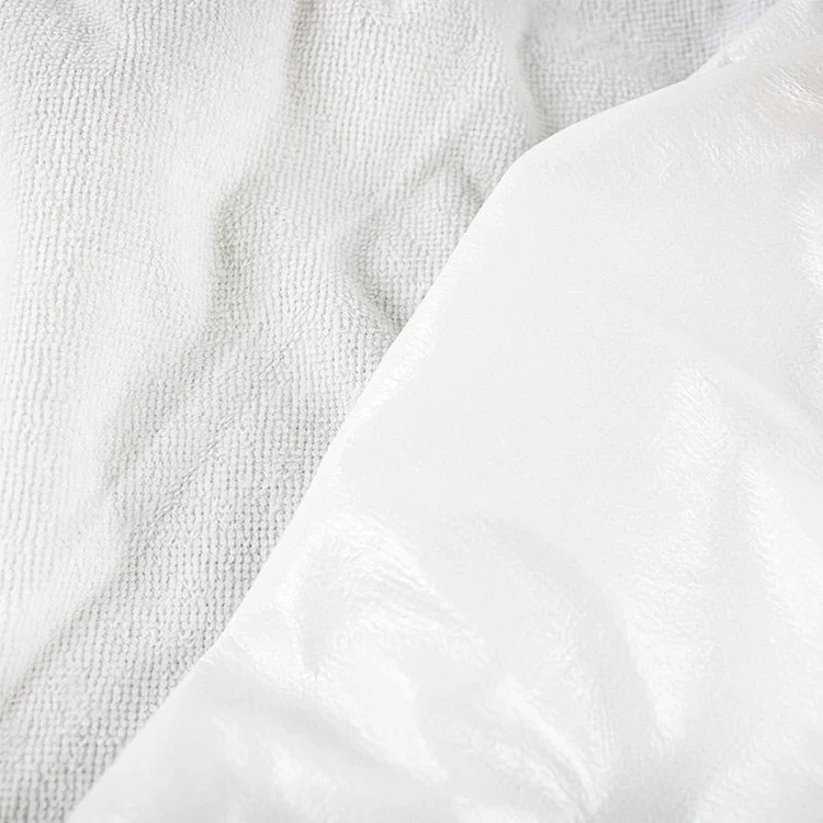 Waterproof Lining Kit: close-up of the two layers, soft white terry towelling and a smooth, shiny white backing.