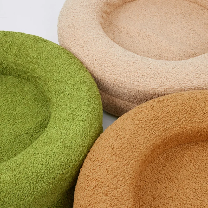 BarneyCurl Bed available in 3 colours | Three dog beds in green, beige, and tan colours arranged together