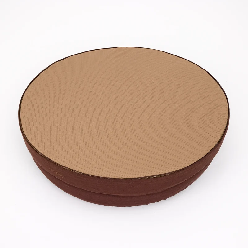 Linen Cover Curl in Moose: the round bed turned over, showing a tan non-slip dotted base zipped to the brown linen sides.