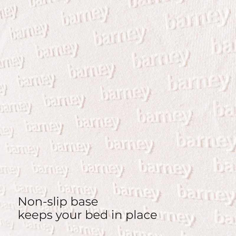 Barney Bed base fabric with an embossed barney pattern and the words Non-slip base keeps your bed in place